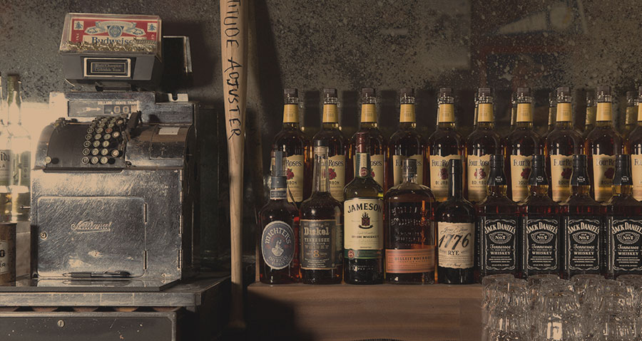gloworder-image-of-antique-cash-register-on-bar-beside-whiskey-bottles